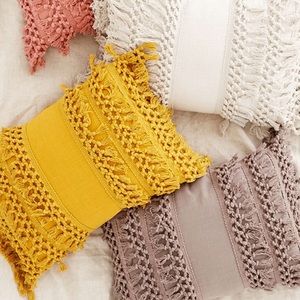 UO yellow tassel throw pillow